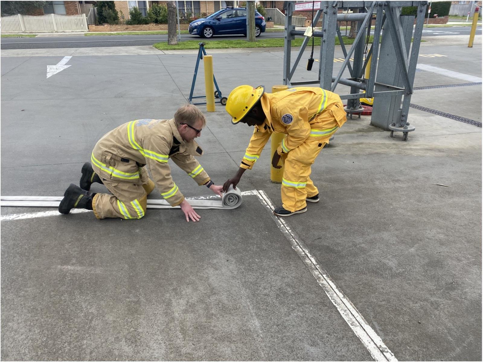 Rolling up hose that had been up the tower